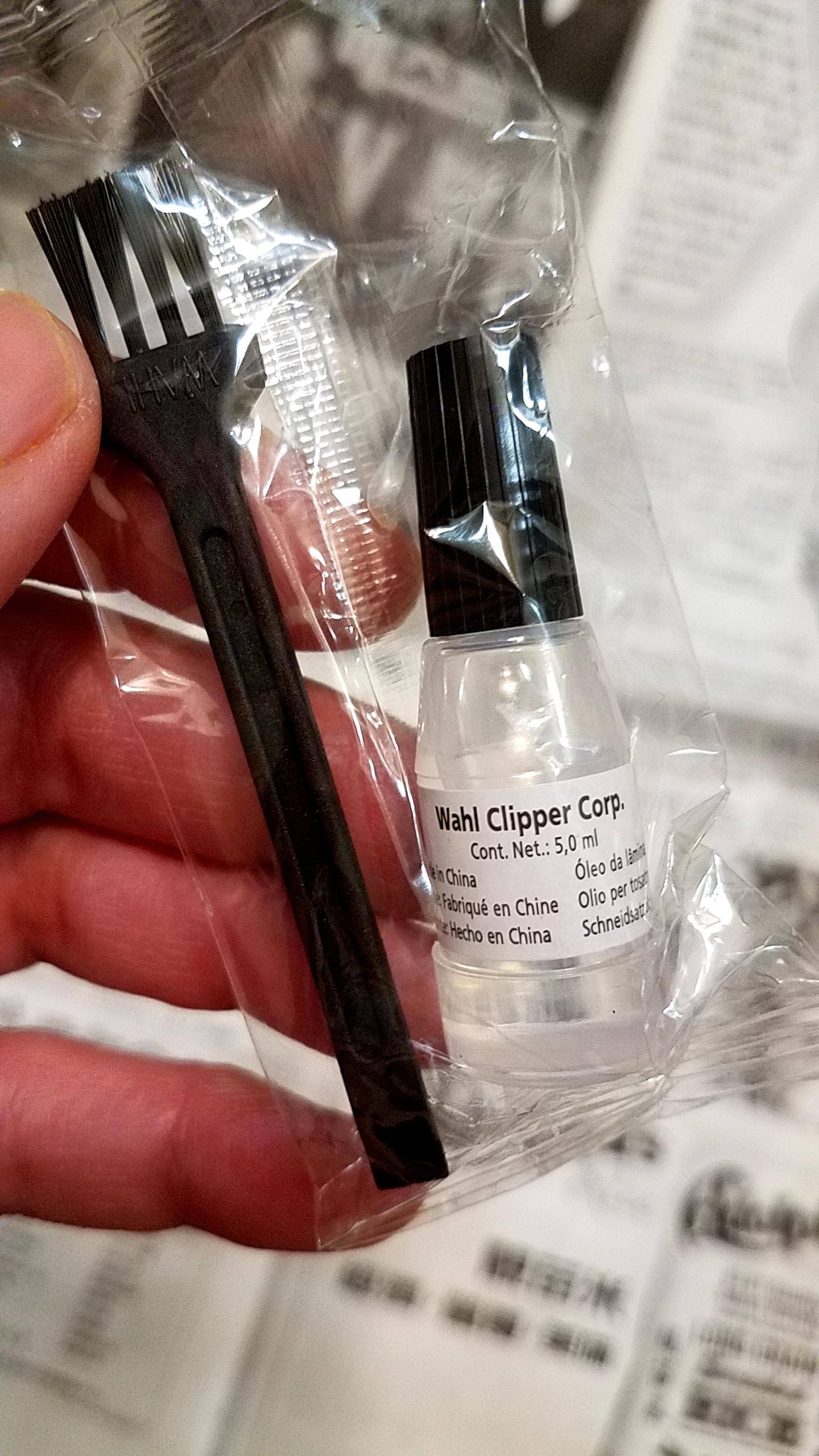 It came with a brush & oil made in China, click to load a larger version