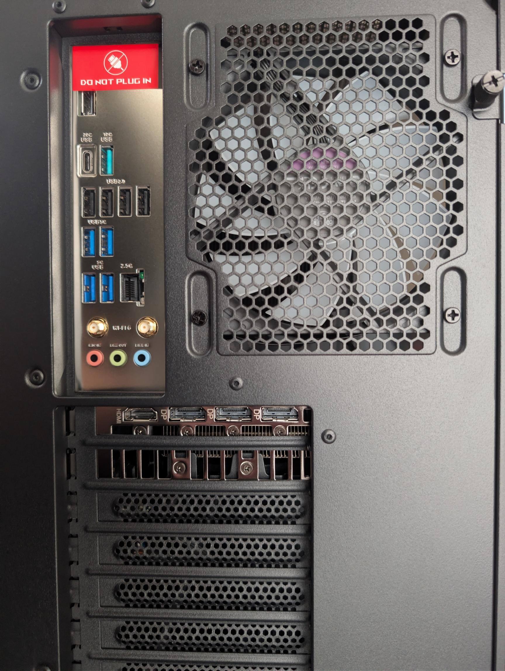 Ports on the back. Note all the USB-A ports (3 different speeds) and the single recessed USB-C port., click to load a larger version