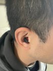 You can see the small cord that juts out. Easy to remove., click to load a larger version