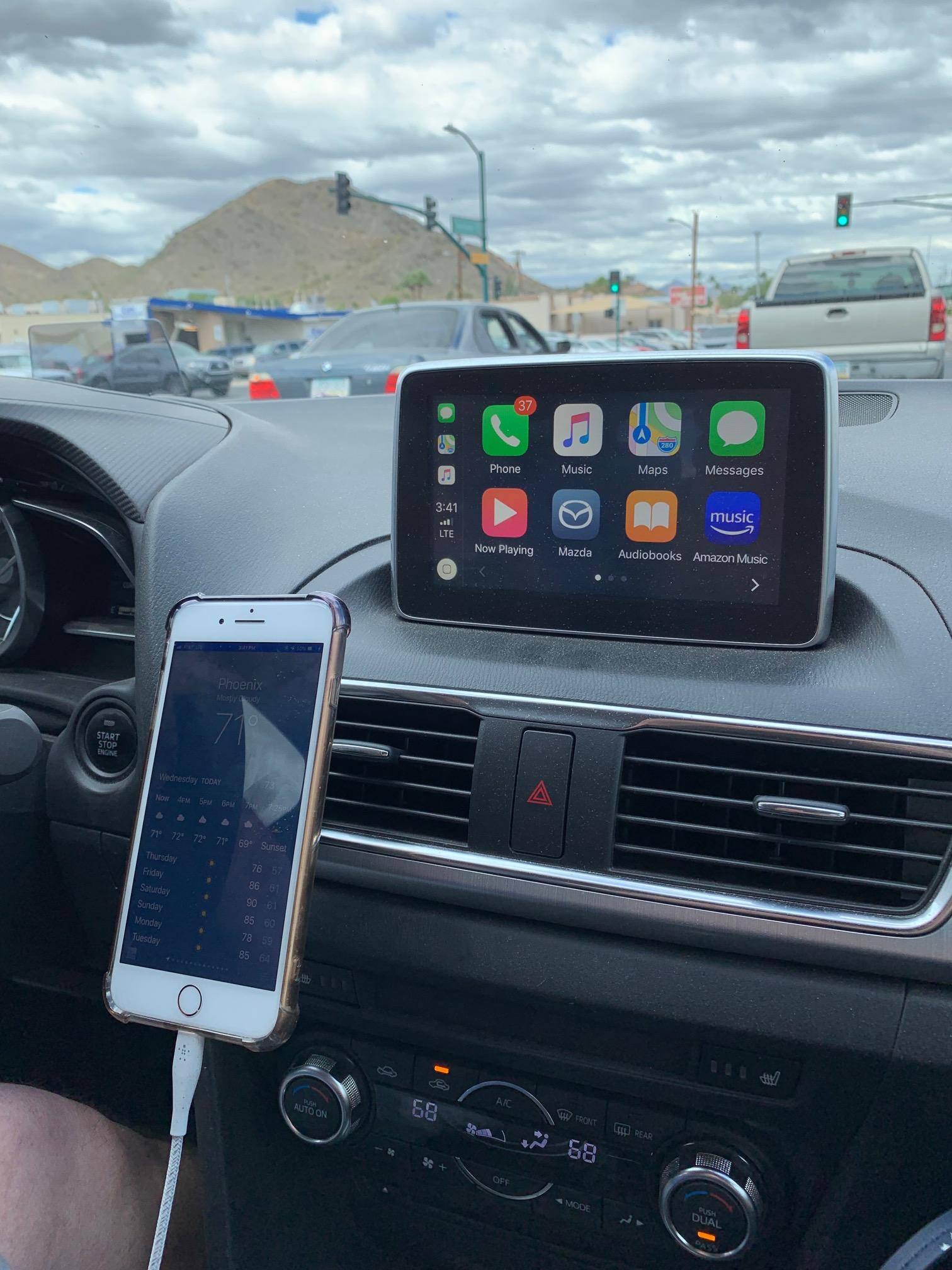 Holding iPhone, click to load a larger version