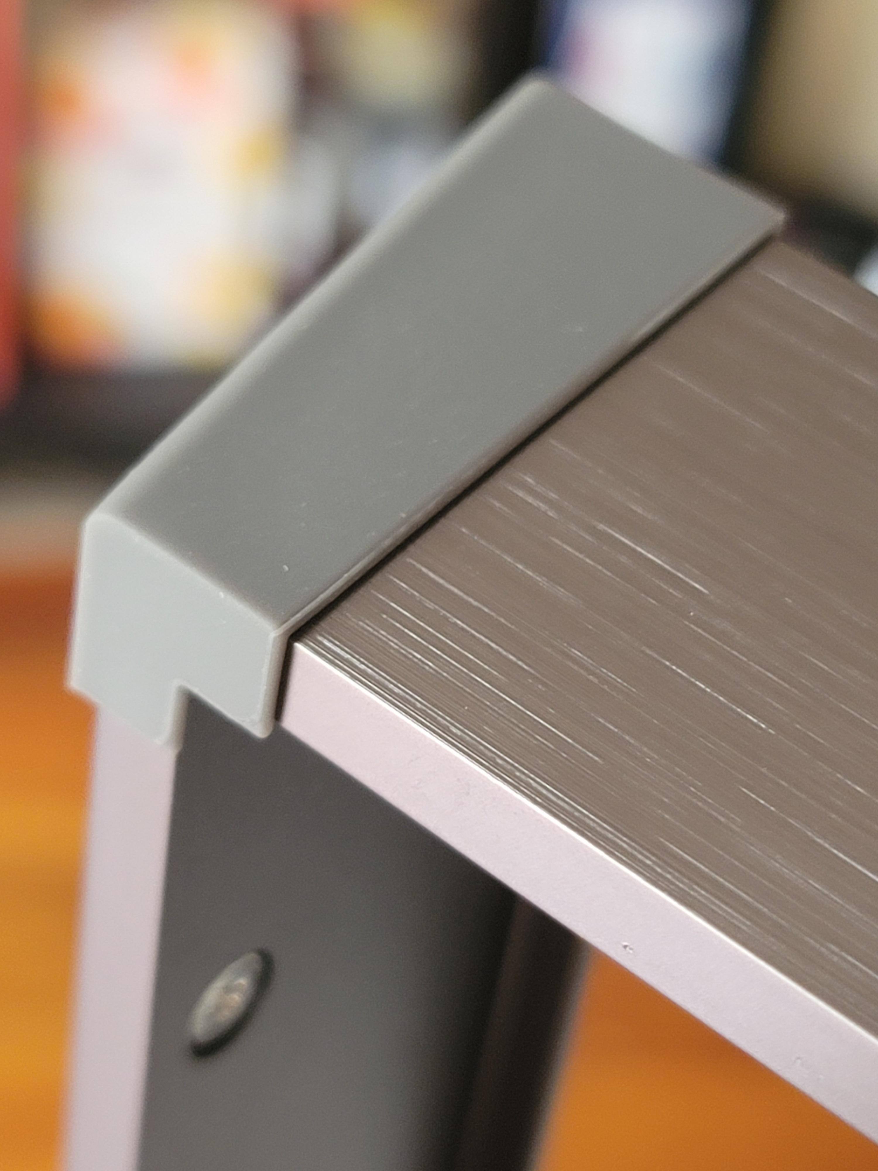 Non Slip rubber feet are glued to each corner of the metallic outer frame, click to load a larger version