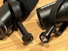 Left: Samson Q9U - screws onto your stand via "hand screw". Right: Shure MV7X - entire mic must rotate to install onto stand., click to load a larger version