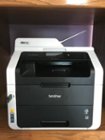 Front view of the printer with a flash drive inserted into the port., click to load a larger version