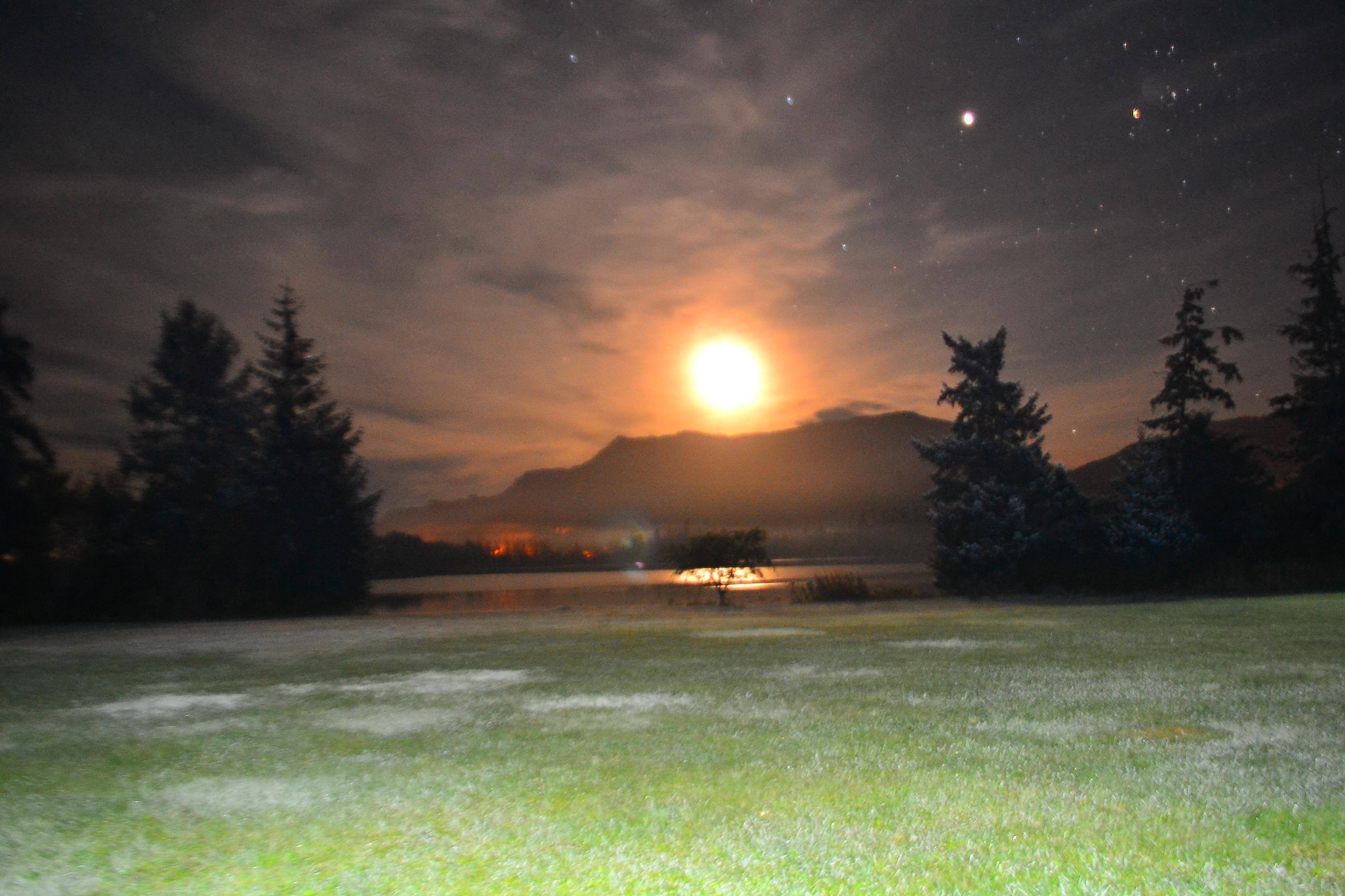Alaskan moon rise on ball field., click to load a larger version