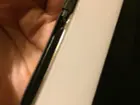 Plastic that has cracked over the power button, click to load a larger version