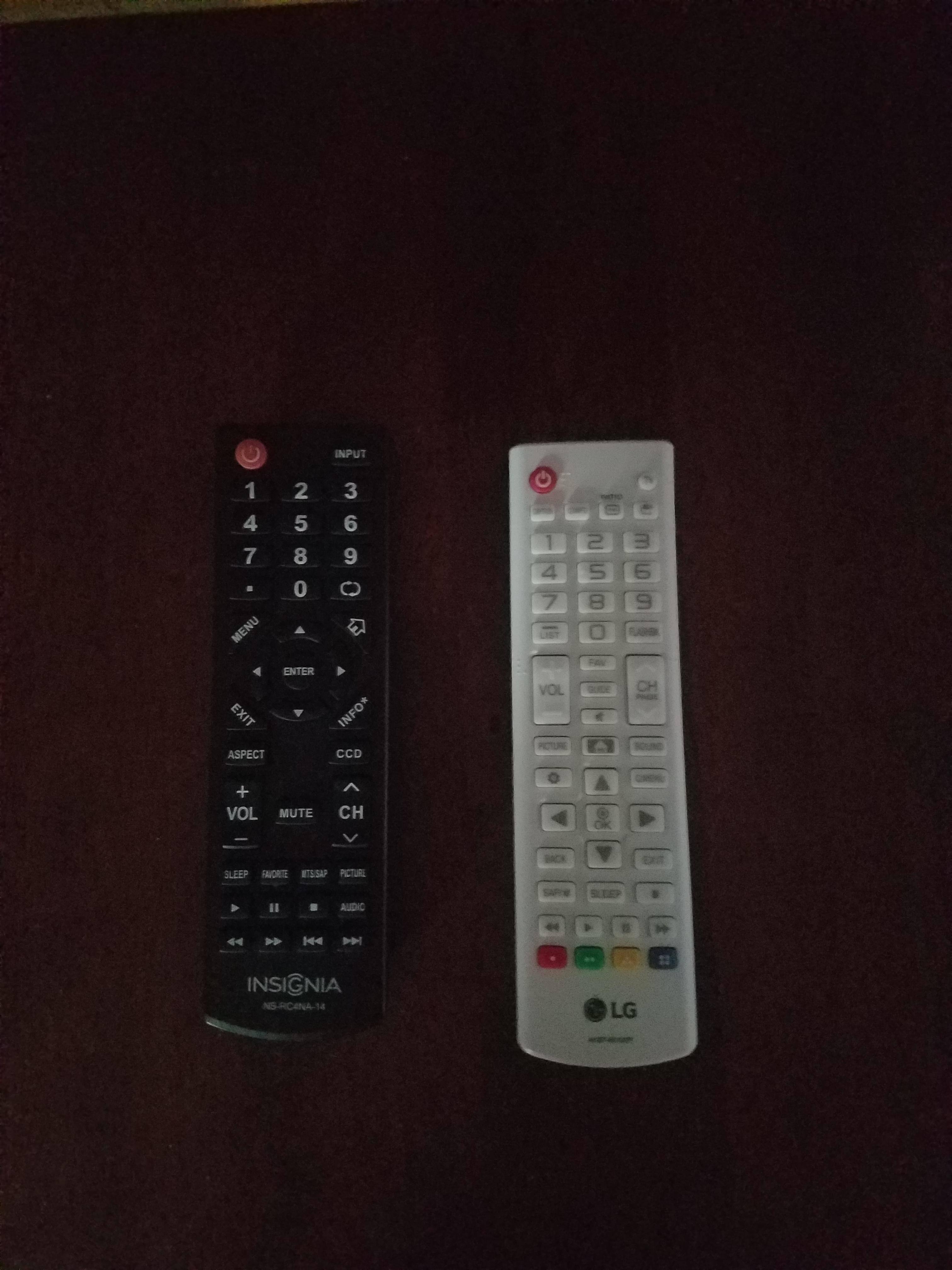 Remote on the right, button lettering is light gray and cant be seen when lights are low., click to load a larger version