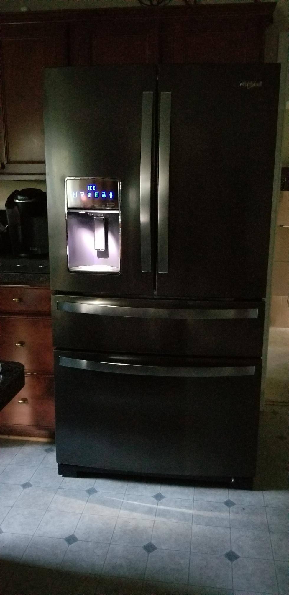 Like the look of the black stainless, although it is more charcoal grey; would prefer a true black matte frig. The stainless is a film, but I am prepared to ahve it scratch up and will paint it with chalkboard paint when it does. I like the black sides, click to load a larger version