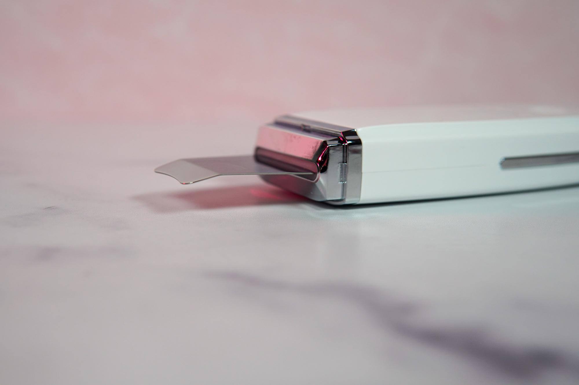 View of the thin metal piece that touches the skin when ON., click to load a larger version