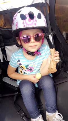 My daughter insists on always holding the speaker (or having it next to her) when she's in the stroller or out for a bike ride., click to load a larger version