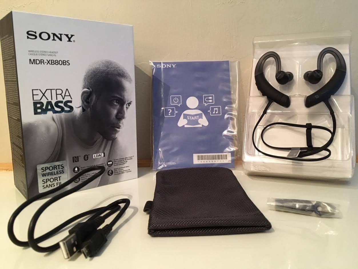 Included out of the box: charger, extra buds in various sizes, operating instructions, warranty card, carrying pouch, and cable adjuster., click to load a larger version