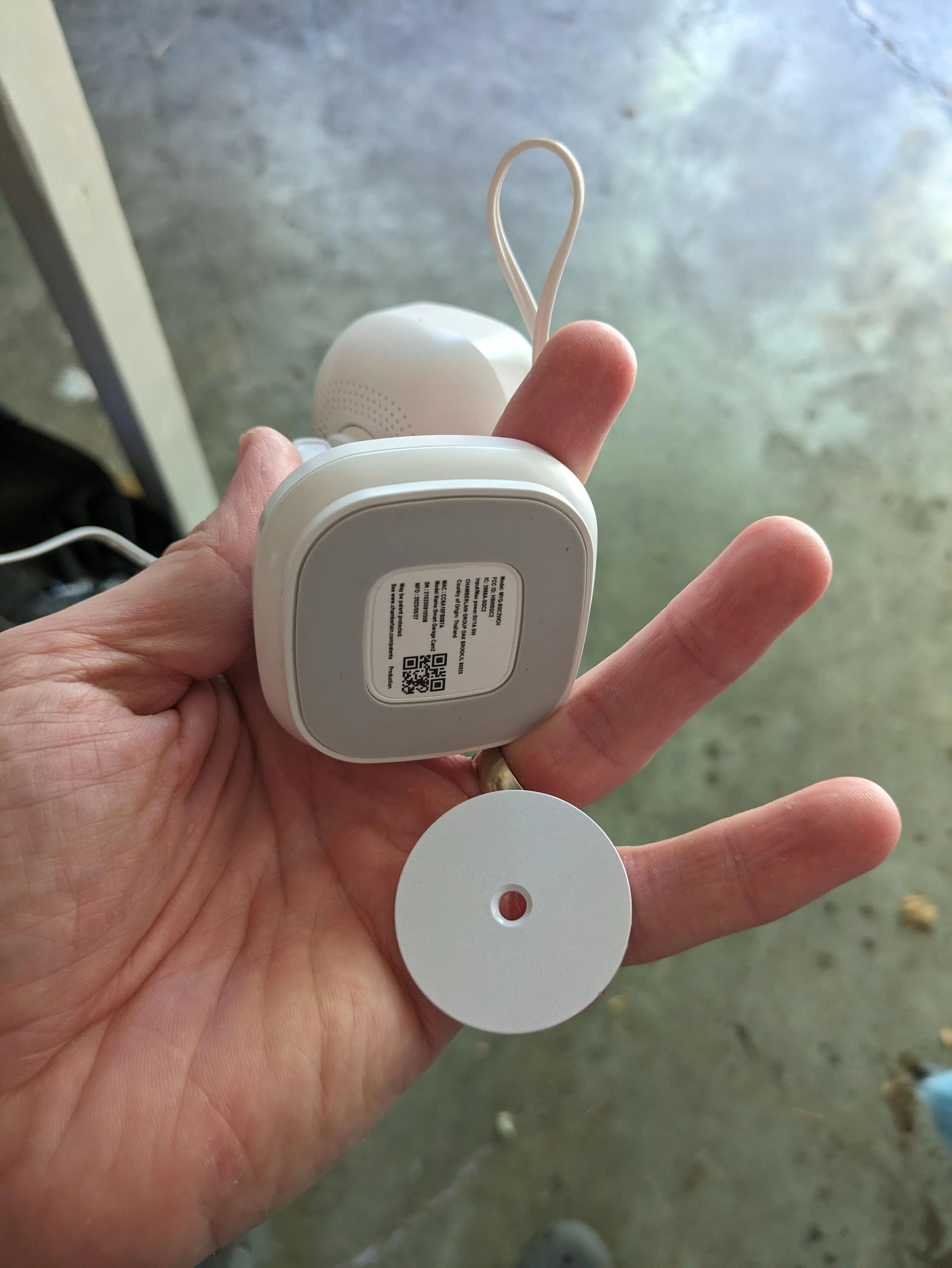 The magnetic base - you can either use the adhesive backing, or screw it into the wall/ceiling with a screw using the hole in the middle, click to load a larger version