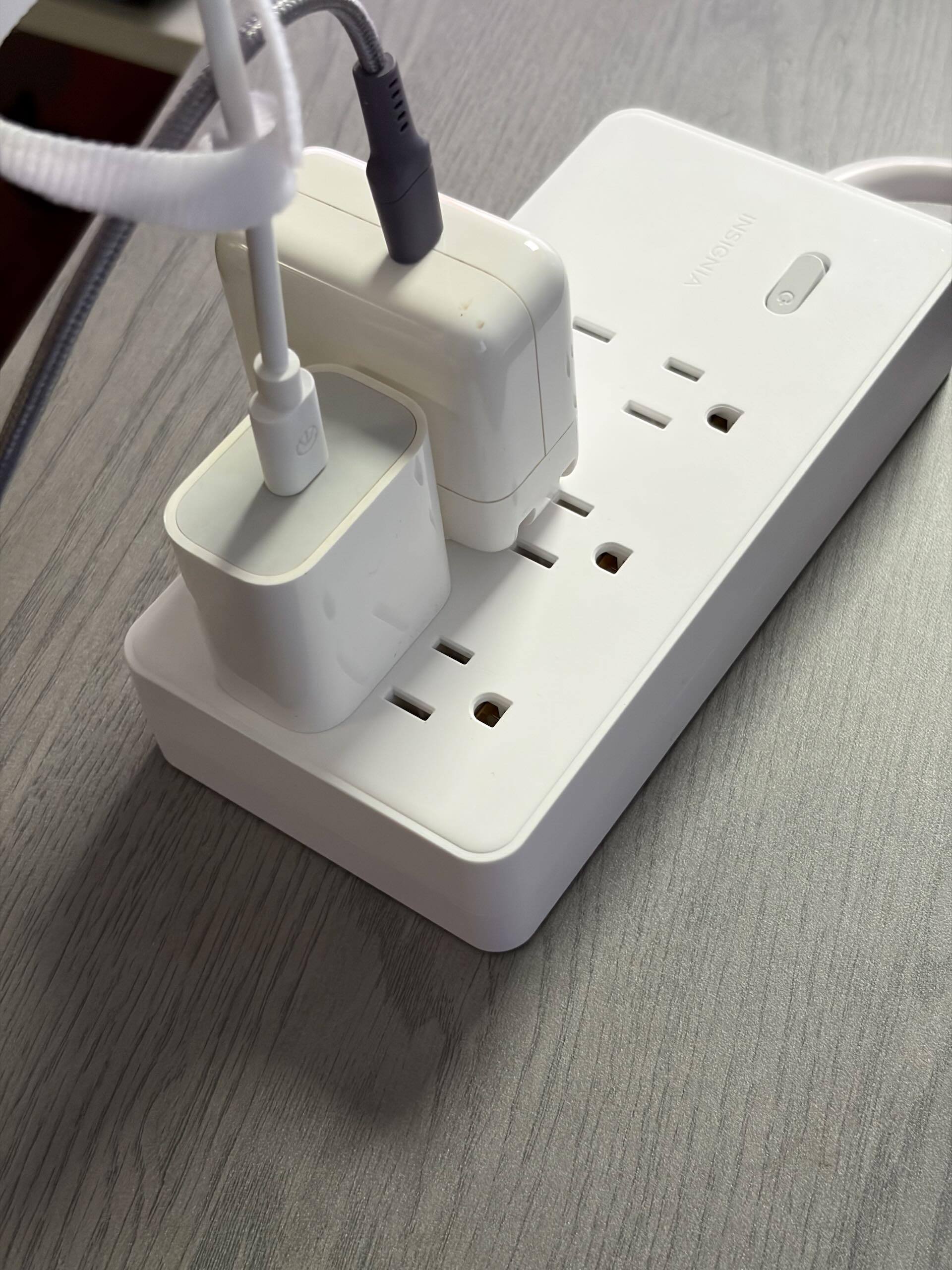 A small USB charger does not block other outlets., click to load a larger version