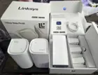 Everything inside: 3 nodes/routers, 3 power supplies, one ethernet cable, 1 QR code.You can see the circular light that's on top of each node., click to load a larger version
