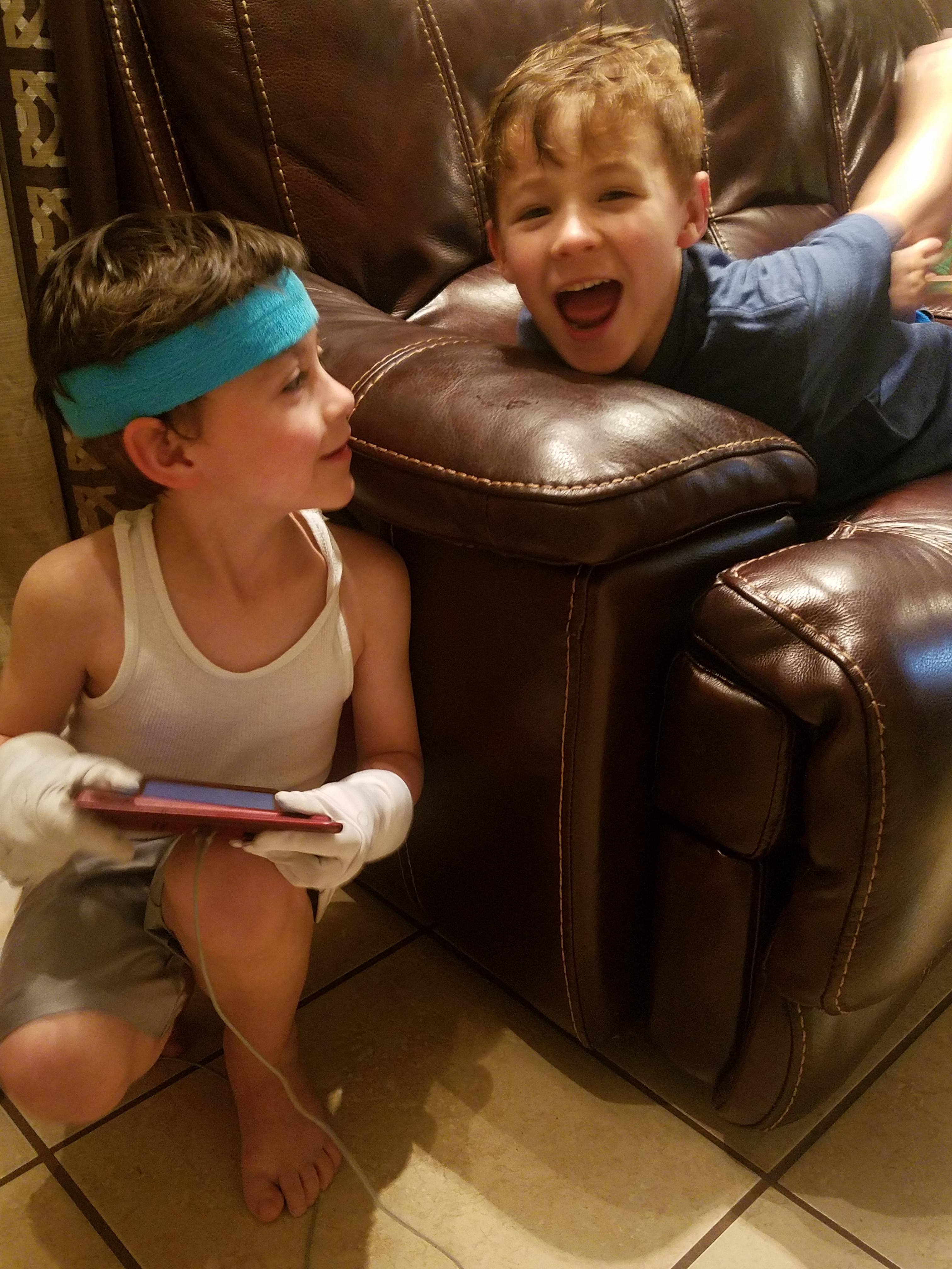 Playing Mario Maker with his Luigi gloves, click to load a larger version