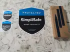 SimpliSafe window decals and yard stakes, click to load a larger version