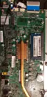The standar hard drive mounts in a cage out of view. Memory is visible as a single slot. The main board is accessible after removing the back cover and metal shield., click to load a larger version