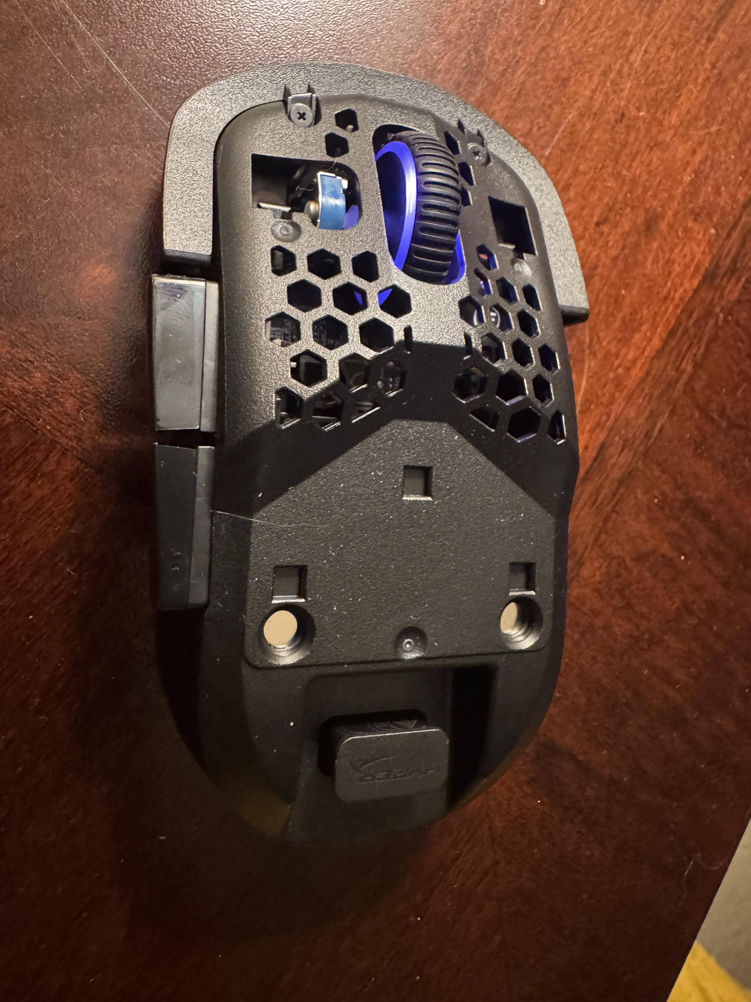 Naked, this mouse is interesting to look at.  Notice the USB storage area for the receiver., click to load a larger version