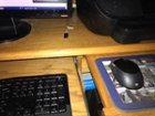 Keyboard, dongle (on desk), mouse, click to load a larger version