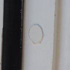 Flush-mounted DoorSense sensor in the door jamb. We found that after installation, the unit felt a tad loose in its bore hole; we wrapped the sensor in Teflon plumber's tape to take up the empty space., click to load a larger version