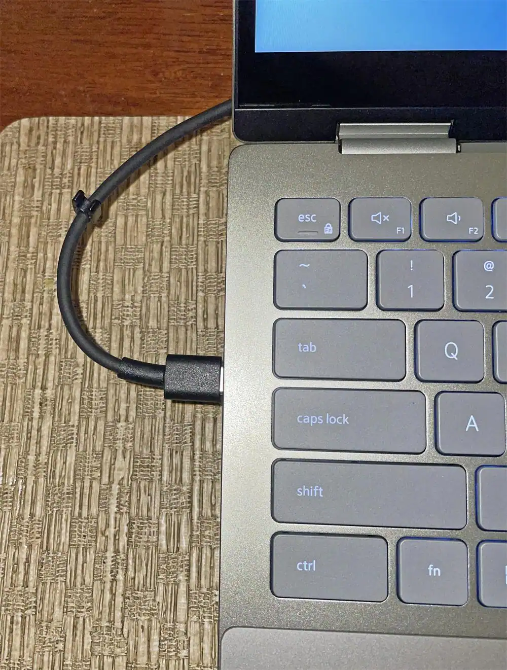 My one BIG complaint about this laptop - the placement of the two USC-C ports are midway down one side (used for charging). So when you charge, your cable is right there, in the middle, sticking out. Why not a port at the top? Ugh., click to load a larger version
