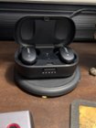 Case with buds on Qi charging pad showing status., click to load a larger version