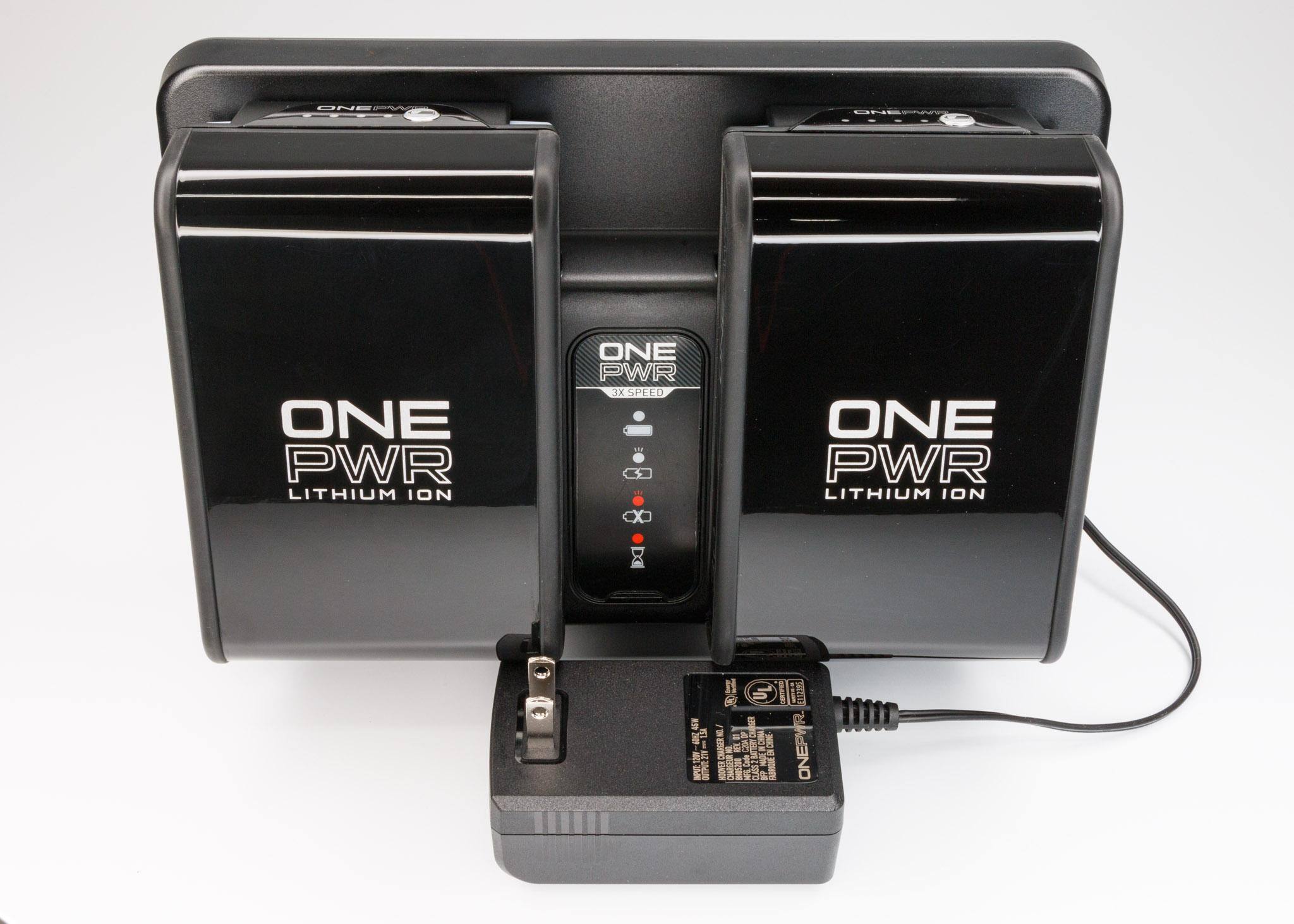 Charger holding a couple of batteries.Batteries Not Included, click to load a larger version