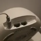 Rear view of BE25 router with two 2.5 Gbps WAN/LAN Ethernet ports, WPS button, and power port, click to load a larger version