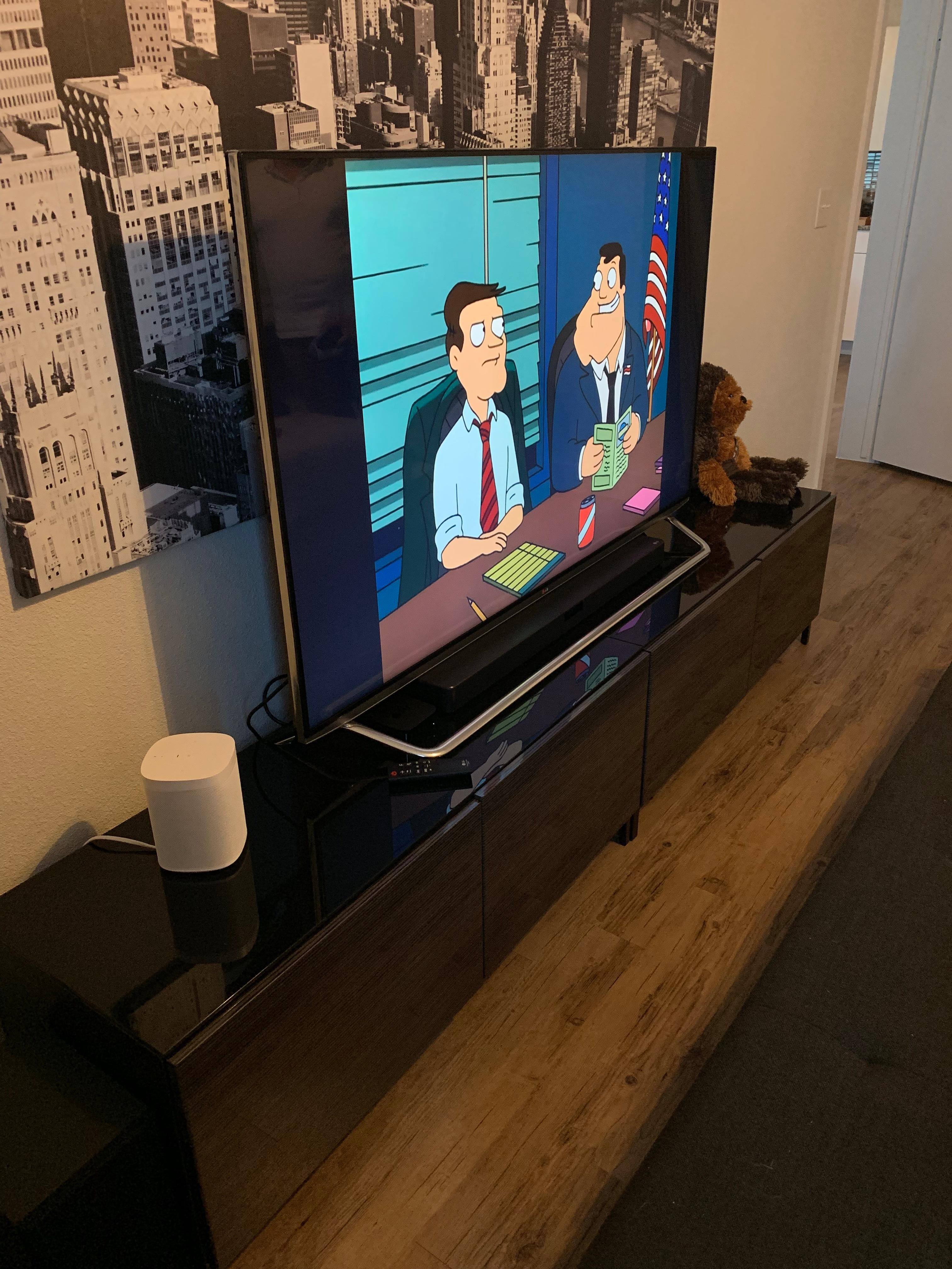 Placed neatly below 65" TV in the bedroom., click to load a larger version