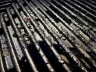 No easy way to clean grates when you can't use metal, click to load a larger version