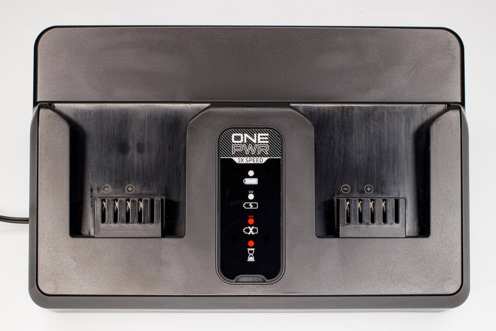 Charger with cover but without batteries., click to load a larger version