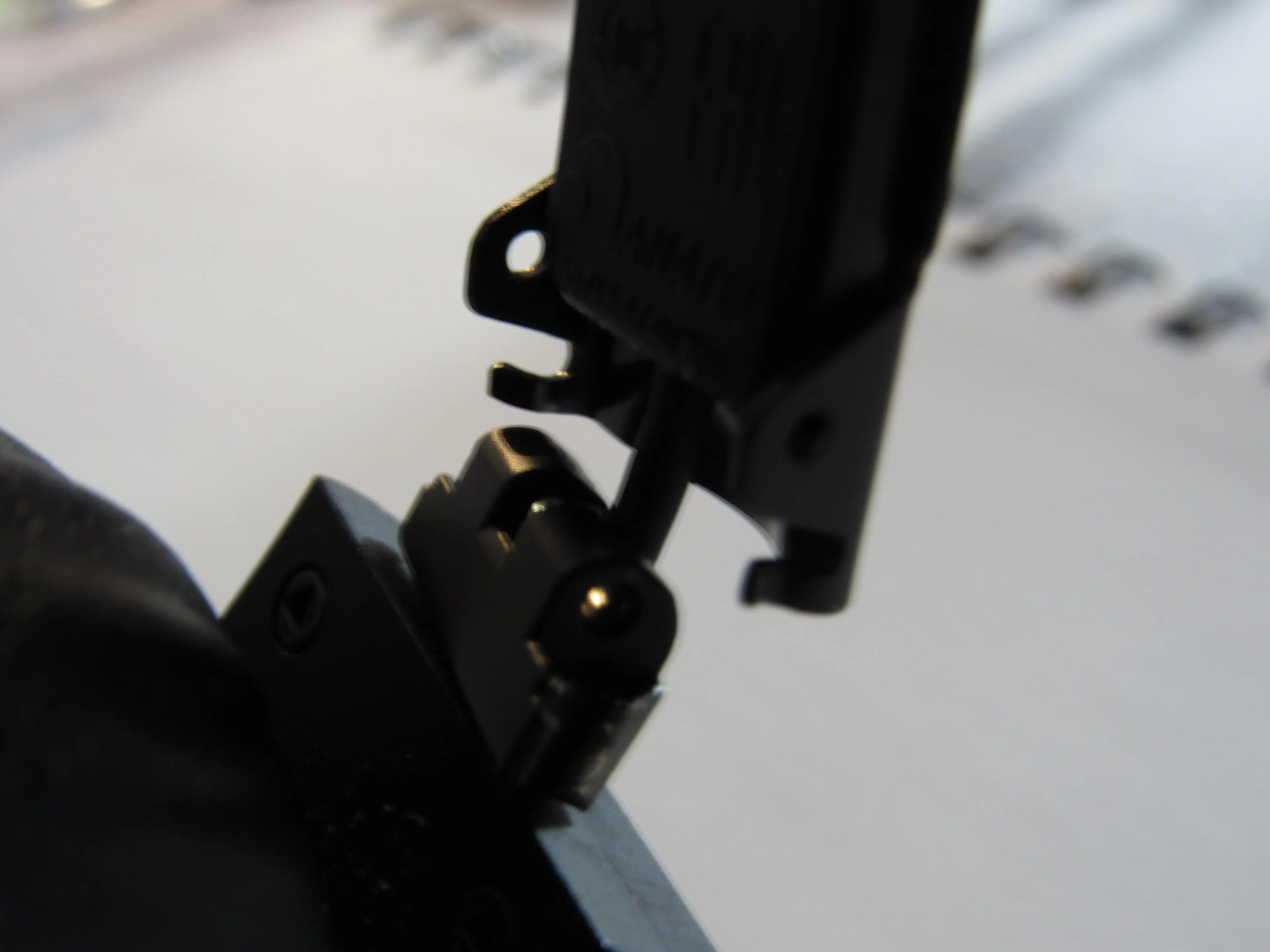 Picture of the right speaker completely missing hinge and dangling with wire exposed, click to load a larger version