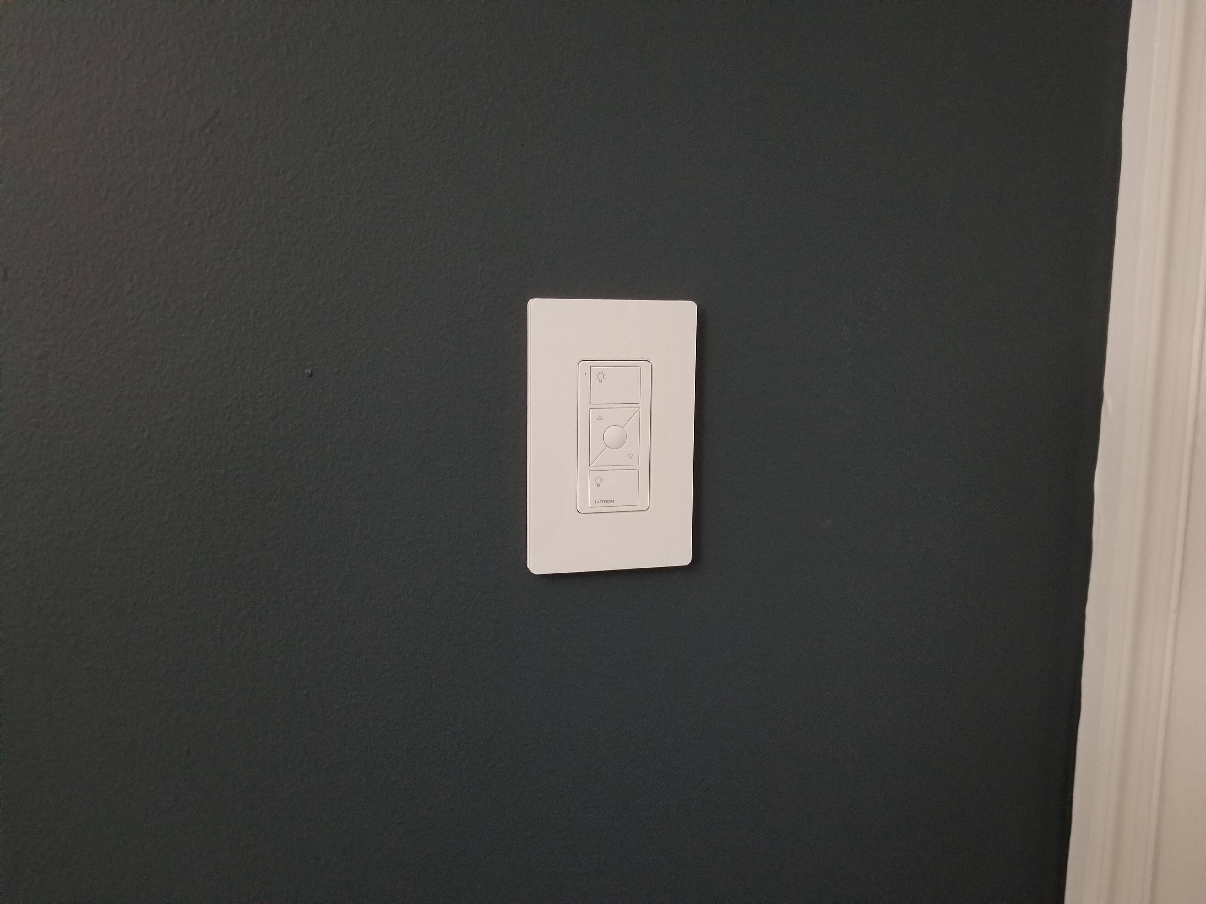 The Pico remote mounted around the corner from the main switch (no actual wiring behind this), click to load a larger version
