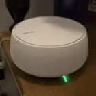 Deco BE5000 router powered on with internet connection (LED is green), click to load a larger version