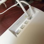 Ethernet (1 WAN and 3 LAN) and power ports on the back of the unit, click to load a larger version