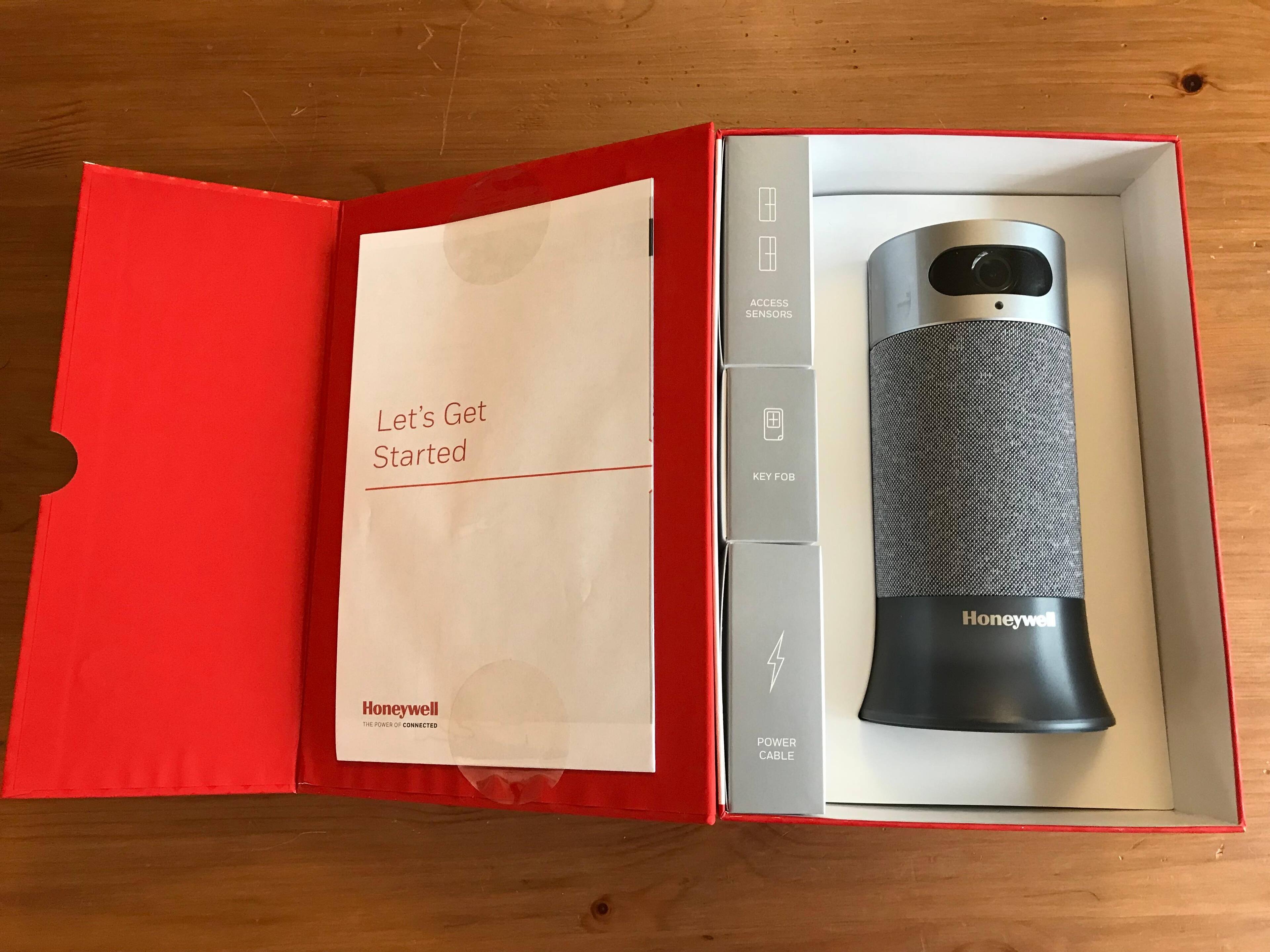 Includes the camera base station, two door sensors and fob., click to load a larger version