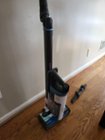 Storing the vacuum. The base hooks onto the extension pole with the brush head attached. It's plenty sturdy and won't fall over on its own, but I really wish there was a wall hanging/charging solution, click to load a larger version