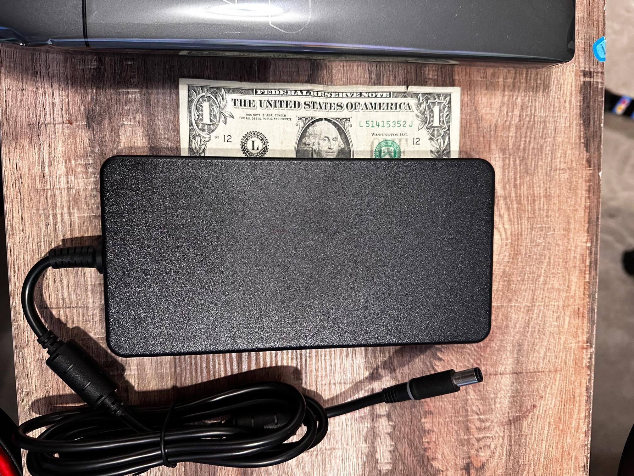Huge power brick, dollar for size comparison., click to load a larger version