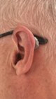 Tiny behind-the-ear electronics, click to load a larger version