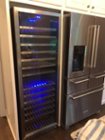 kitchenaid fridge next to our wine cooler. i had to drink a lot of whine after the "great flood" to calm my nerves., click to load a larger version