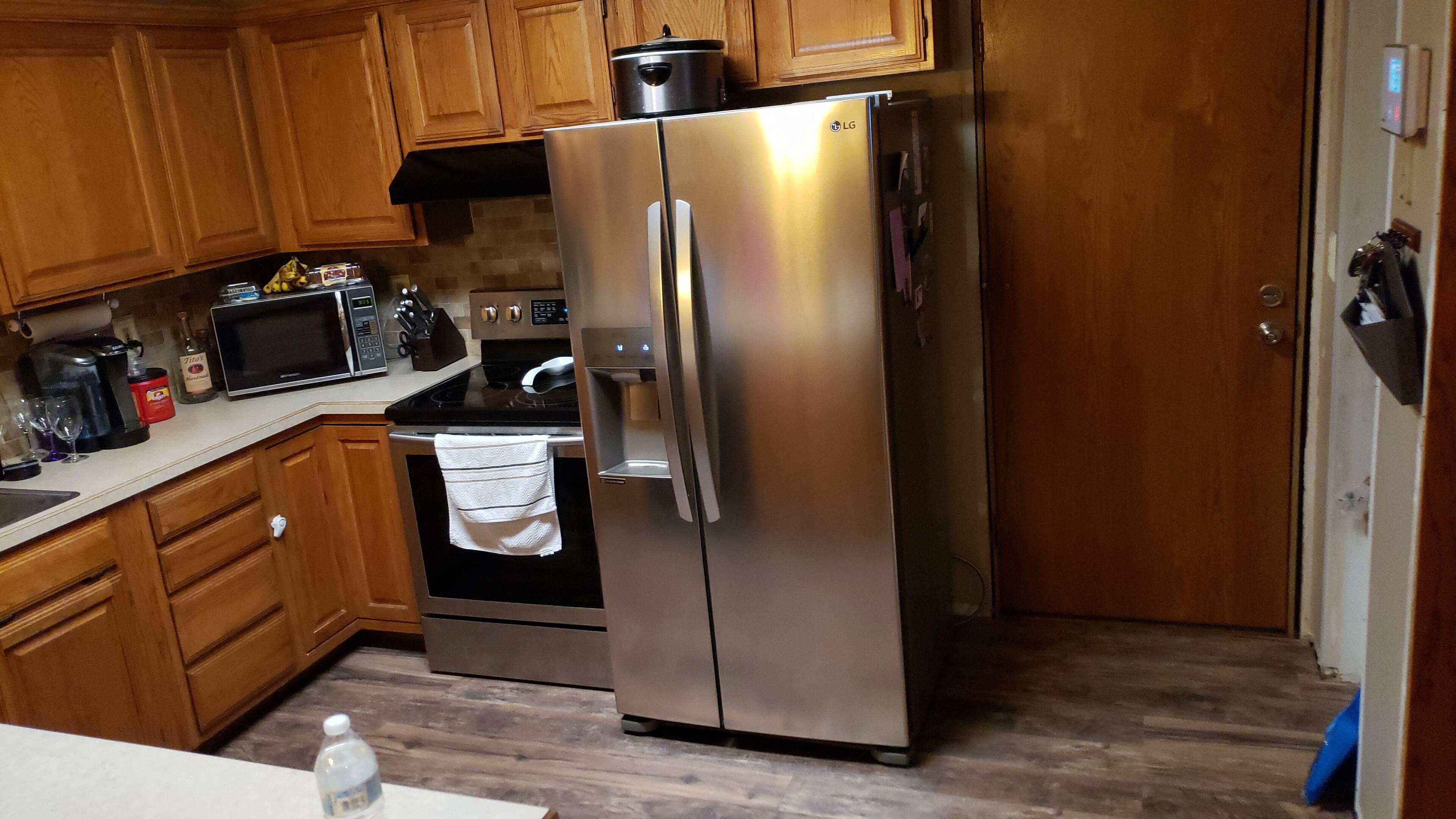 New fridge clears the cabinet with ease., click to load a larger version