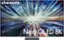 The image features a Samsung Neo QLED 8K television, which is the largest text in the image. The television is displayed in a large, brightly lit room, with a blue and green background. The screen is filled with a colorful and dynamic scene, showcasing the high-quality display capabilities of the Neo QLED 8K TV.